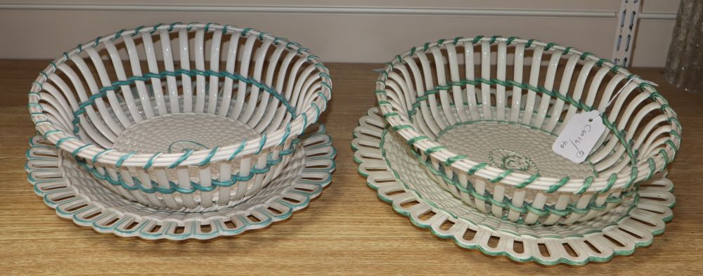 Two late 18th century Wedgwood creamware chestnut baskets and stands, length 30cm